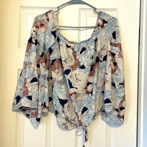 Off the shoulder blouse. With tie around waist.